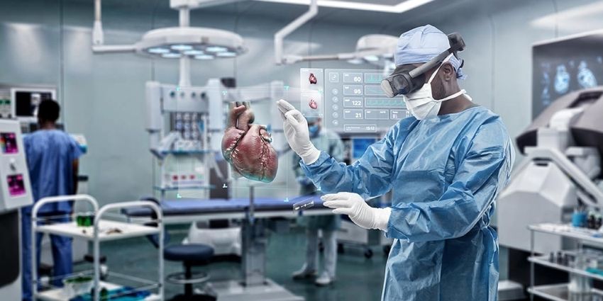 HTC Vive headset being worn by a surgeon doing simulated heart surgery