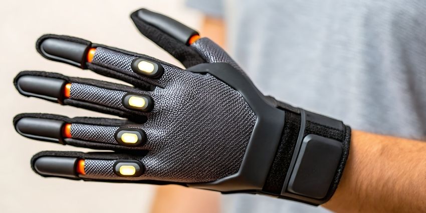 Person wearing an electronic glove.