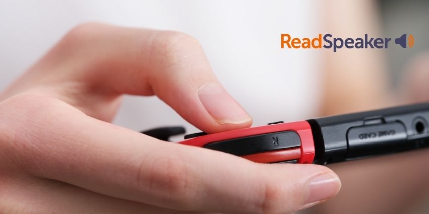 Handheld games console being played, close up.
